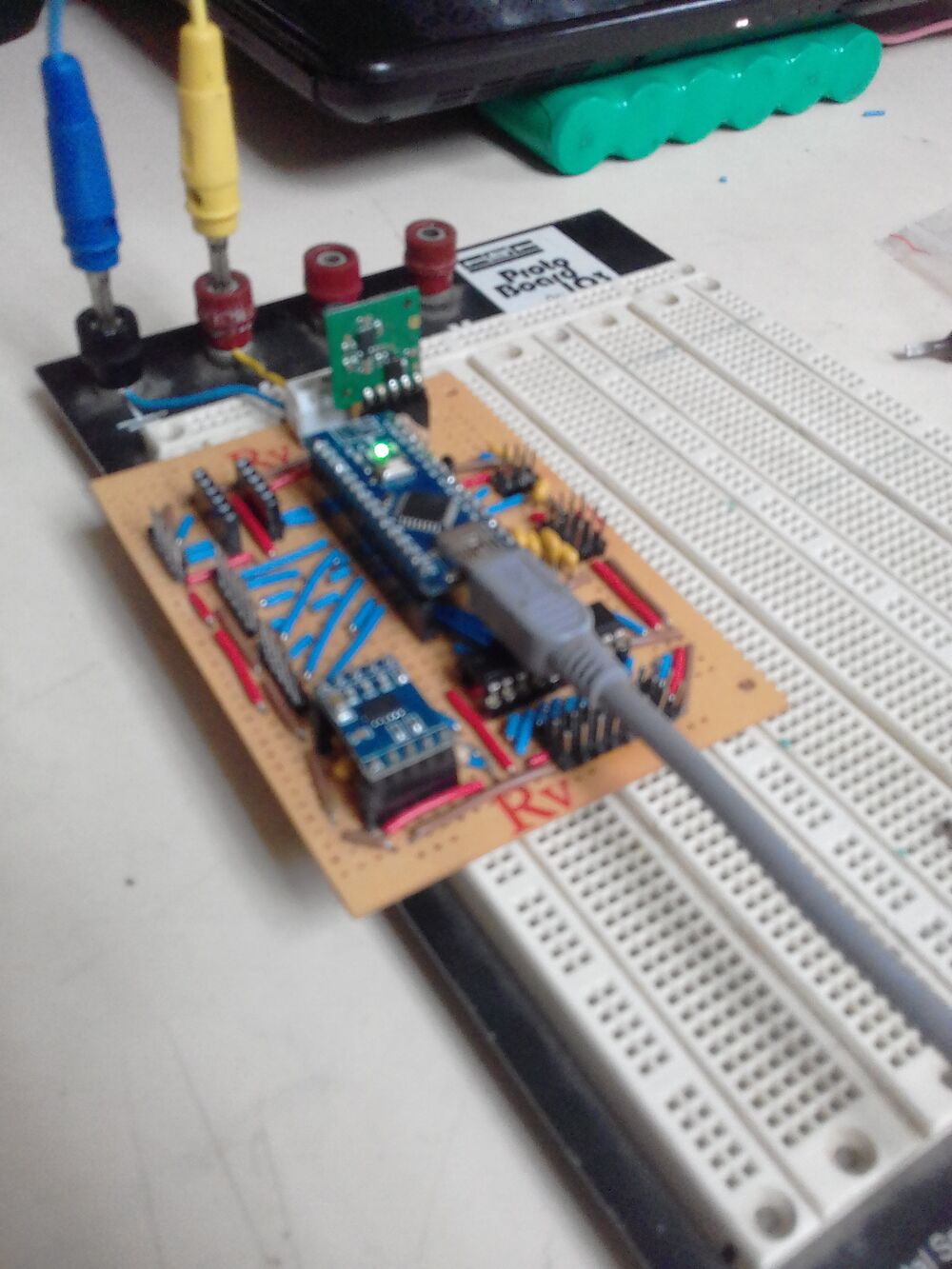 Hand-wired perfboard control board for Atlas, with the Arduino Nano, an accelerometer breakout and point-to-point wiring between the driver and sensor connectors