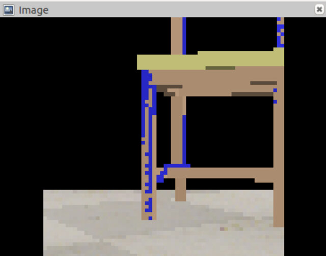 The robot's on-board vision sensor feed shown in rqt image view: a pixelated view of a table and floor