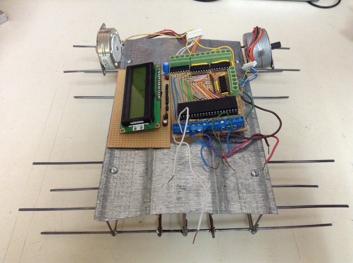A side view of the assembled chassis showing the stepper motors and wheel mounts at the rear