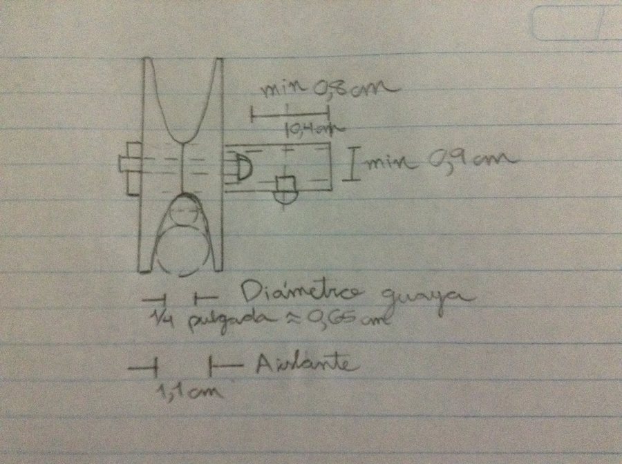 A hand-drawn design sketch dimensioning the wheel groove against the cable diameter (0.65 cm) and the insulator diameter (1.1 cm)