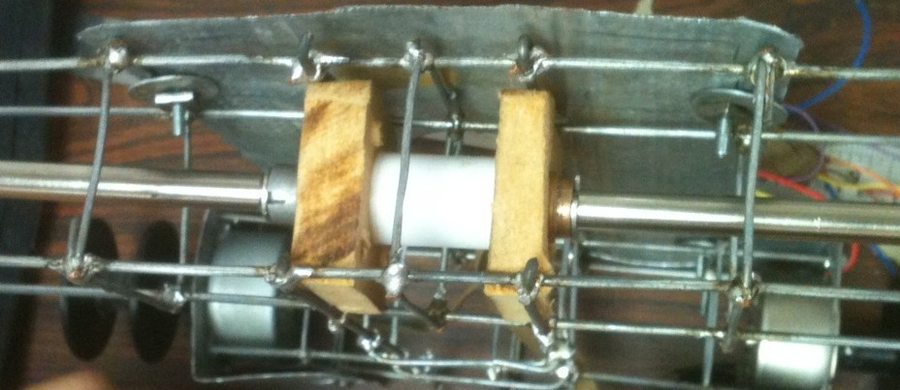Close-up of the robot's front axle and bearings, which let the front wheels spin freely while being pushed by the rear stepper motors